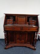A reproduction mahogany desk