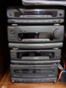 An inlaid mahogany hifi cabinet containing technics four piece stack system,