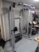 A gym spec cable cross over machine with bar attachments