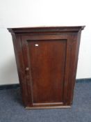 A Georgian oak hanging corner cupboard CONDITION REPORT: 100 cm x 73 cm .