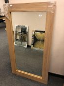 An oak effect flat framed mirror