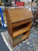 A mid century walnut bureau bookcase