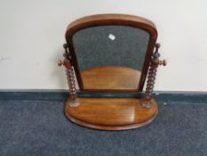 A Victorian mahogany toilet mirror with barley twist columns