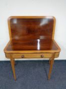 A Victorian inlaid mahogany tea table fitted with a drawer CONDITION REPORT: Warp