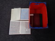 A box and four albums of stamps,