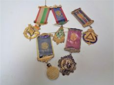 A box of five silver ROAB medals on ribbons