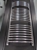 A chrome wall mounted heated towel rail