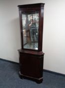 A mahogany corner display cabinet