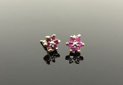 A pair of gold ruby cluster earrings
