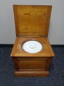 An Edwardian satin walnut commode