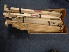A box of four folding wooden easels
