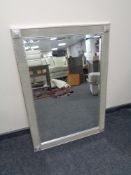 A contemporary silvered framed mirror