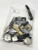 A bag of various wristwatches, pens,