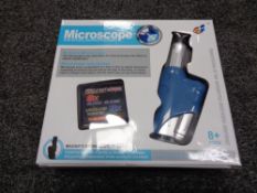 Thirty-six educational microscopes (in four boxes)