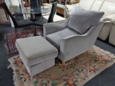 A contemporary armchair with storage footstool CONDITION REPORT: This is suede,