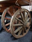 Two wooden cart wheels