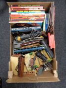A box of Hornby railways track, accessories, annuals including A-team, air wolf,