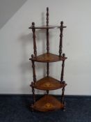 A Victorian inlaid mahogany four tier what not stand