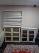 Two early 20th century painted glazed door kitchen cabinets together with a painted pine plate rack