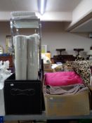 A leather storage box together with one other box containing bathroom stand, woolen blankets,