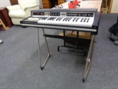 A mid century Avon rose-morris electric organ