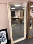 An ivory style swept frame mirror 75 cm x 167 cm.
