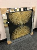 A golden sunburst mirror