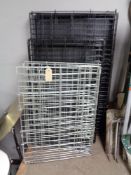 Three folding metal dog cages