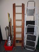 A wooden triple section extension ladder
