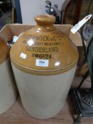 A large stoneware glazed flagon - R. Fenwick & Company, Sunderland.