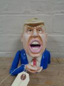 A metal novelty money box - Donald Trump