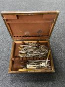 An Edwardian oak canteen of silver plated cutlery