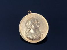 A Charles II yellow metal medallion Charles and Catherine Colonization medal 1670