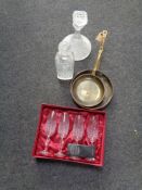 Two copper brass handled sauce pans together with two decanters and a set of four crystal champagne