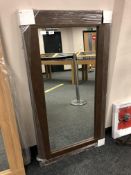 A brown contemporary flat framed mirror