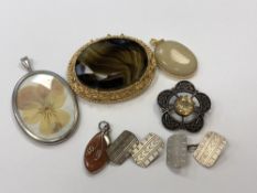 A pair of silver cuff links, Celtic silver brooch,