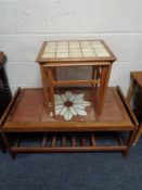 A 20th century teak tiled topped coffee table and nest of two teak tiled topped coffee tables