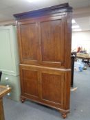 A 19th century oak four door corner cabinet