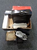 A box of belts and sunglasses