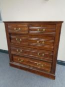 An Edwardian five drawer chest with brass drop handles