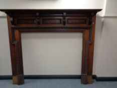 An Edwardian oak fire surround