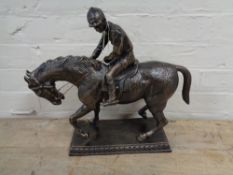 A metal figure - Horse with jockey
