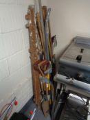 A pair of folding garden steps and four bundles of assorted garden tools