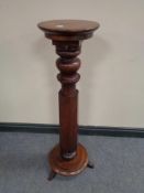 A Victorian mahogany torchere