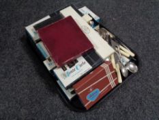 A tray of boxed and unboxed cutlery,