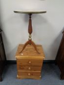 A pine three drawer bedside chest and a wine table