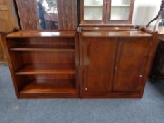 An inlaid mahogany double door cabinet and matching bookshelves