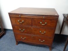 A Georgian mahogany Gentleman's four drawer chest with brass drop handles CONDITION