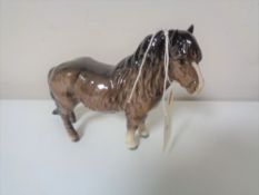 A Beswick brown gloss pony.