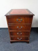 A reproduction mahogany two drawer filing chest with inset leather panel